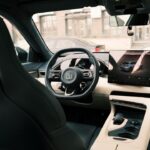 Modern car cabin with a digital dashboard and sculpted interior
