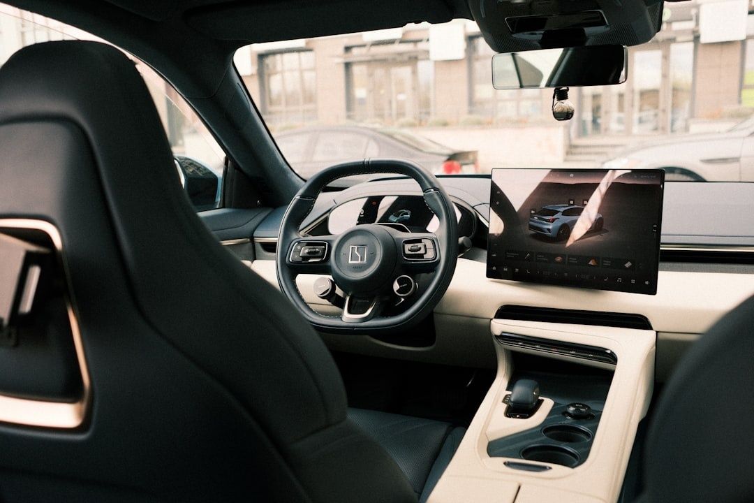 Modern car cabin with a digital dashboard and sculpted interior